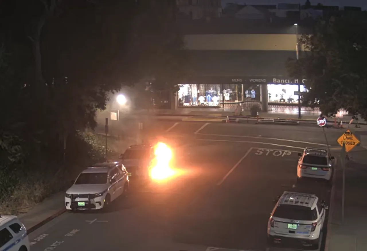 A police car catches on fire due to an arson attack at the University of California, Berkeley on June 1, 2024. (Image courtesy of Department of Justice)
