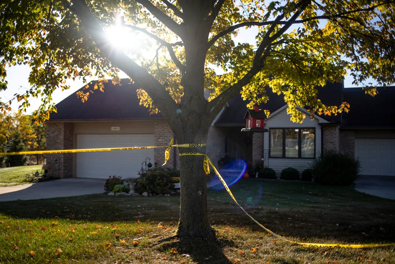 Police tape marking is seen in front of a house across from the Church of Jesus Christ of Latter-day Saints following a shooting and fire. (Photo by Emily Elconin/Getty Images)