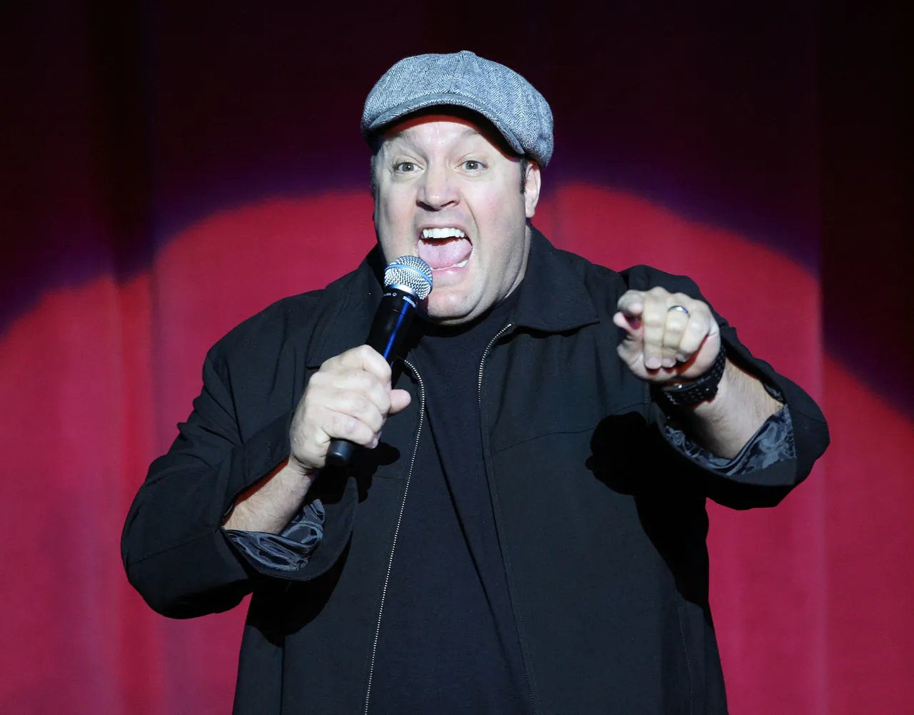 Kevin James performing on stage