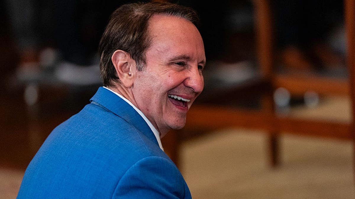 Gov. Jeff Landry stands during a White House event for LSU baseball teams.