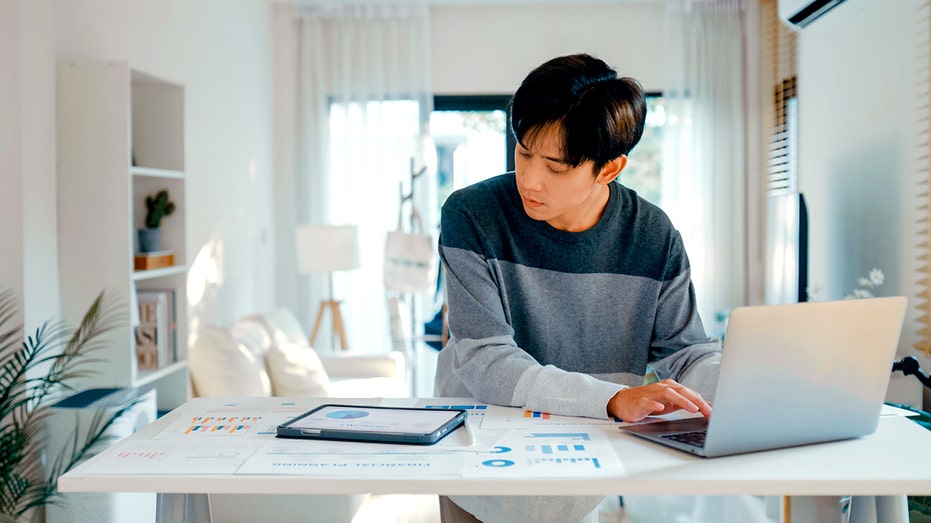 A young person at a desk.