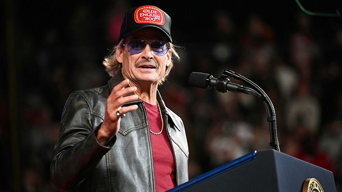 Kid Rock speaks before President Donald Trump takes the stage during a campaign rally.